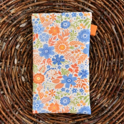 narancs-kék színvilágú, virágmintás, pikk-pakk záras tok